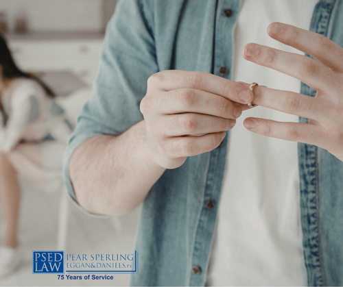 Man taking off wedding ring