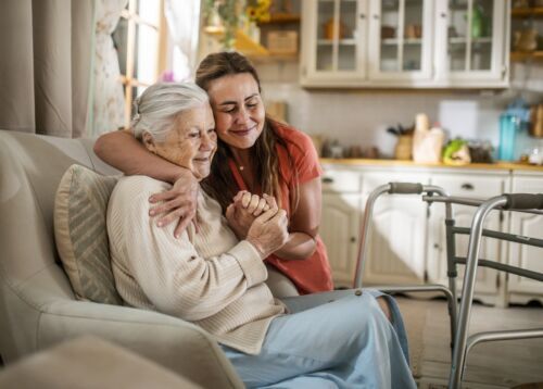 a caregiver hugging a loved one