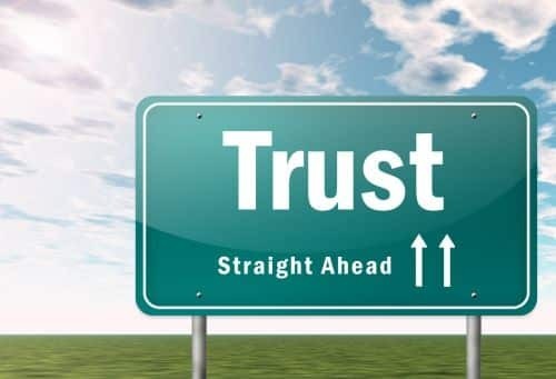 Trust written on a traffic sign