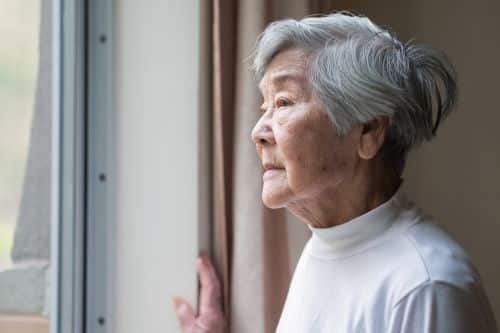 an older woman with a worried look on her face.